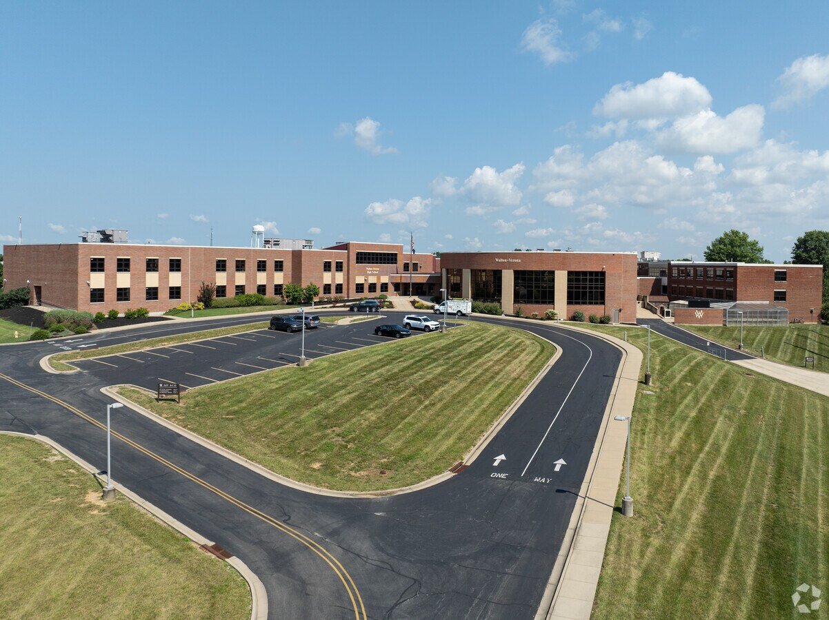 View of a walton verona high school parking lot in Walton KY – homes for sale